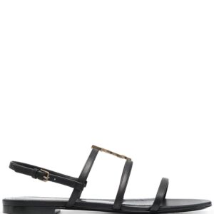 Saint Laurent Cassandra monogram flat sandals.