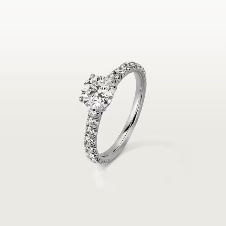 Cartier 1895 solitaire, brilliant-cut diamond, paved