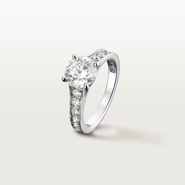 Cartier 1895 solitaire, brilliant-cut diamond, paved